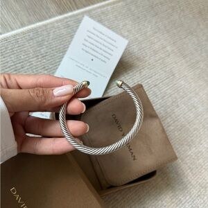 Classic Cable Bracelet
Sterling Silver with 14K Yellow Gold and Blue Topaz, 5mm